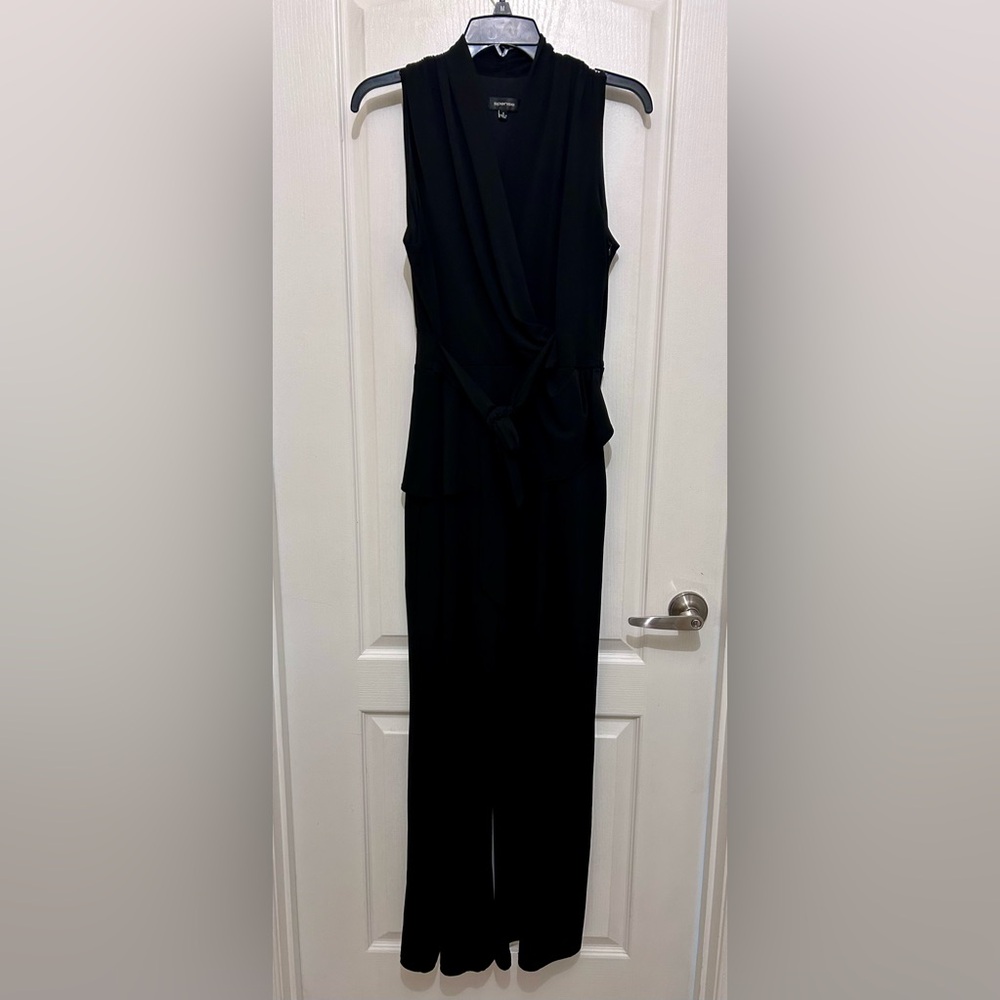Black sleeveless romper with peplum